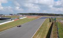 F3 cars exiting Chapel Curve onto the Hangar Straight