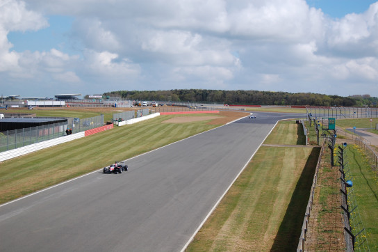 F3 cars exiting Chapel Curve onto the Hangar Straight.